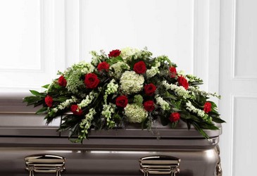 The Sincerity Casket Spray from Clifford's where roses are our specialty